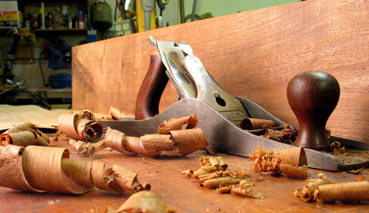 A jointer plane with whisper-thin shavings.